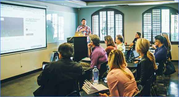 Adults in a classroom learning new skills